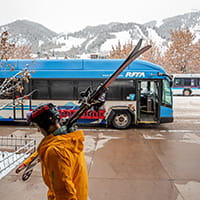 Skier and RFTA bus at bus station