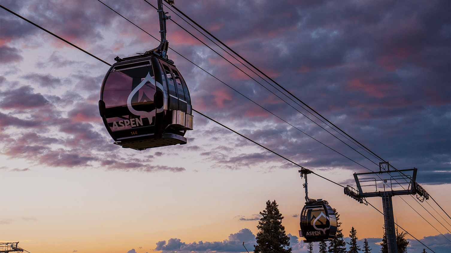 Silver Queen Gondola beneath a beautiful purple sunset at Aspen Mountain