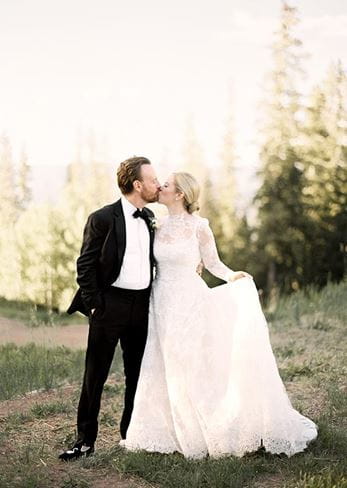 Ashley and Kevin kiss after their Elk Camp wedding