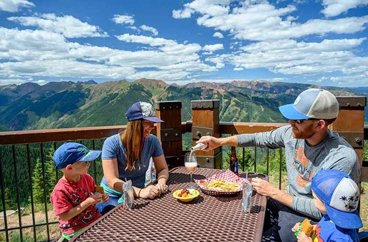 Diners at the Sundeck on Aspen Mountain enjoy a sunny, mountaintop lunch