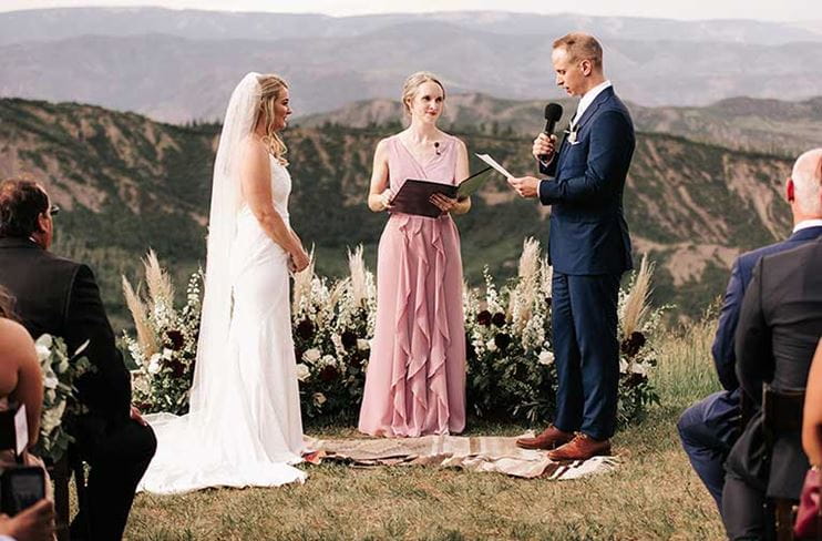 Bride and groom exchange vows at Snowmass mountaintop wedding