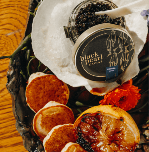 caviar and crudete plated on a large plate at Aspen's cloud nine alpine bistro