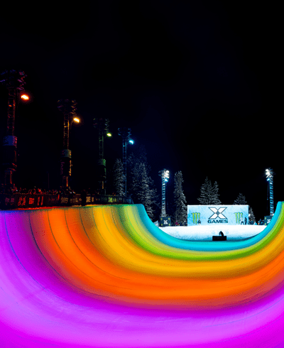 colorful lights illuminate the half pipe at Aspen's XGames