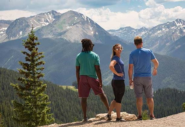 Three friends enjoy the view at Aspen Mountain