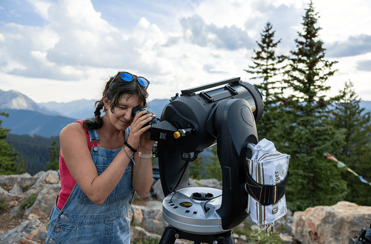Women looking through telescope