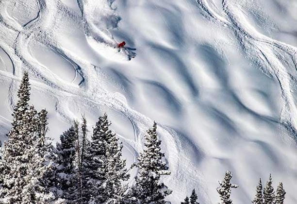 Skier navigating bumps at Aspen Mountain