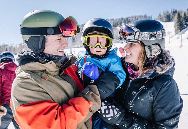 Family cuddles on the slopes