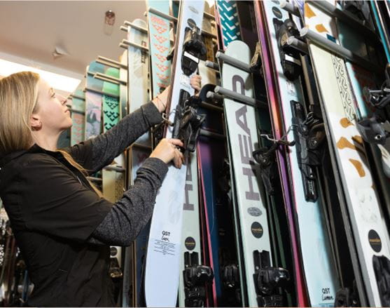 Woman working in a ski rental shop