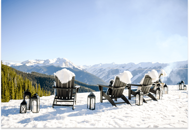 black aderondak chairs on the snow overlooking a beautiful view at aspen snowmass