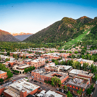 Birds eye view of the town of Aspen as the summer sun sets over the summer town