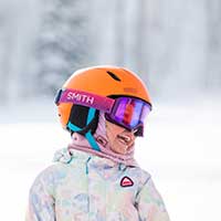 Girl enjoying her skiing lesson