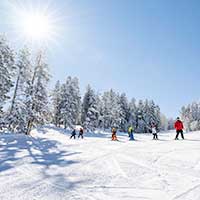 Child ski lessons on a run at Snowmass