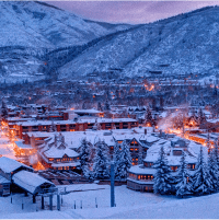 Dusk at Aspen Ski resort, bright lights shine against the snow