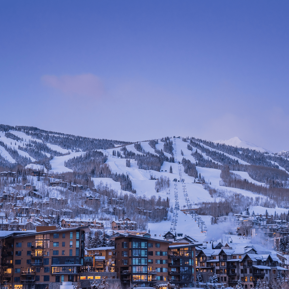 blue skies over snowmass at dawn on a winter morning