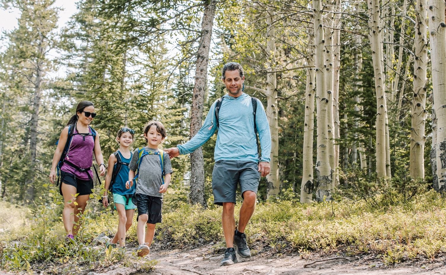 A family hiking at the Lost Forest in Snowmass, Colorado