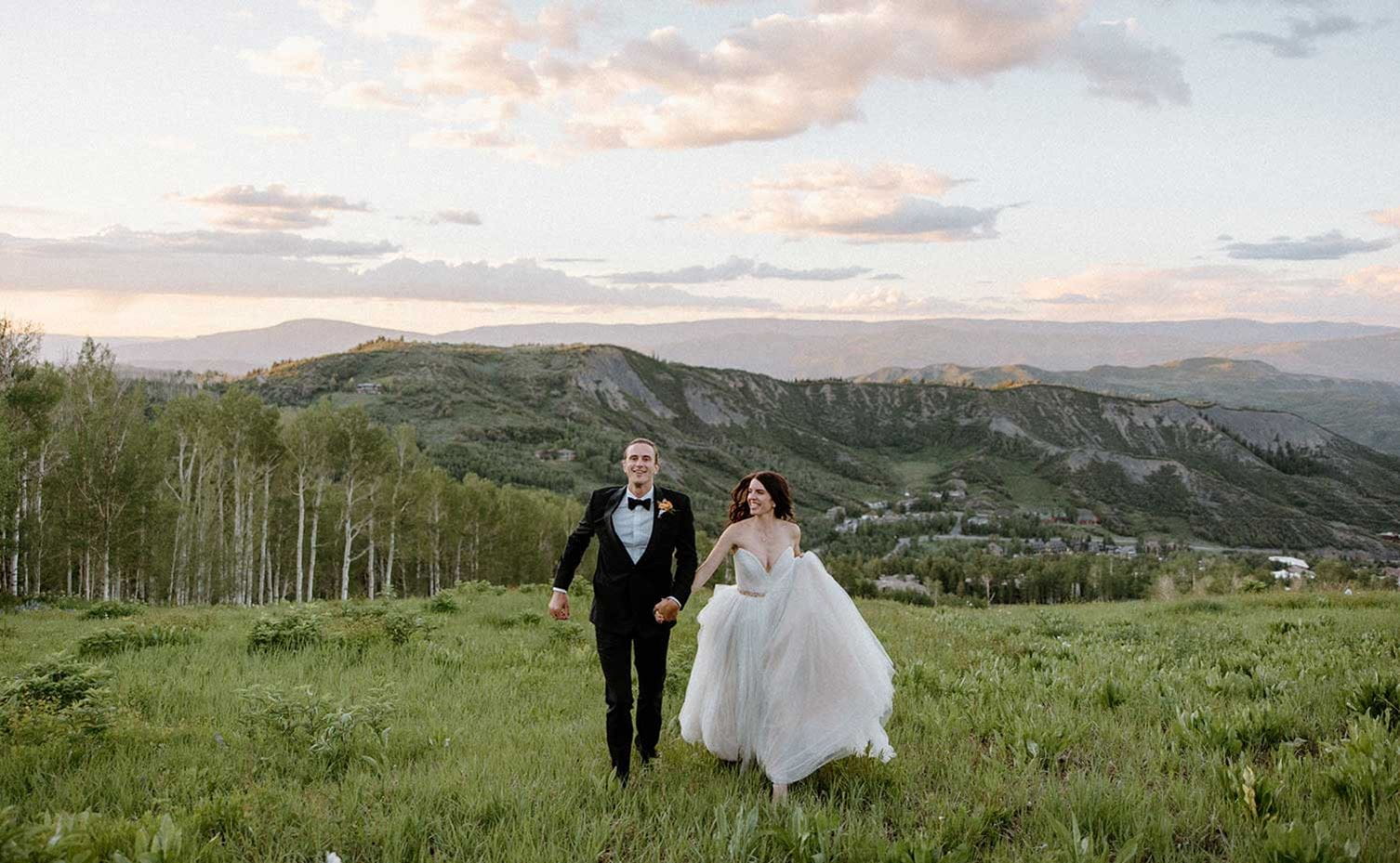 Young couple rejoicing at their Aspen wedding