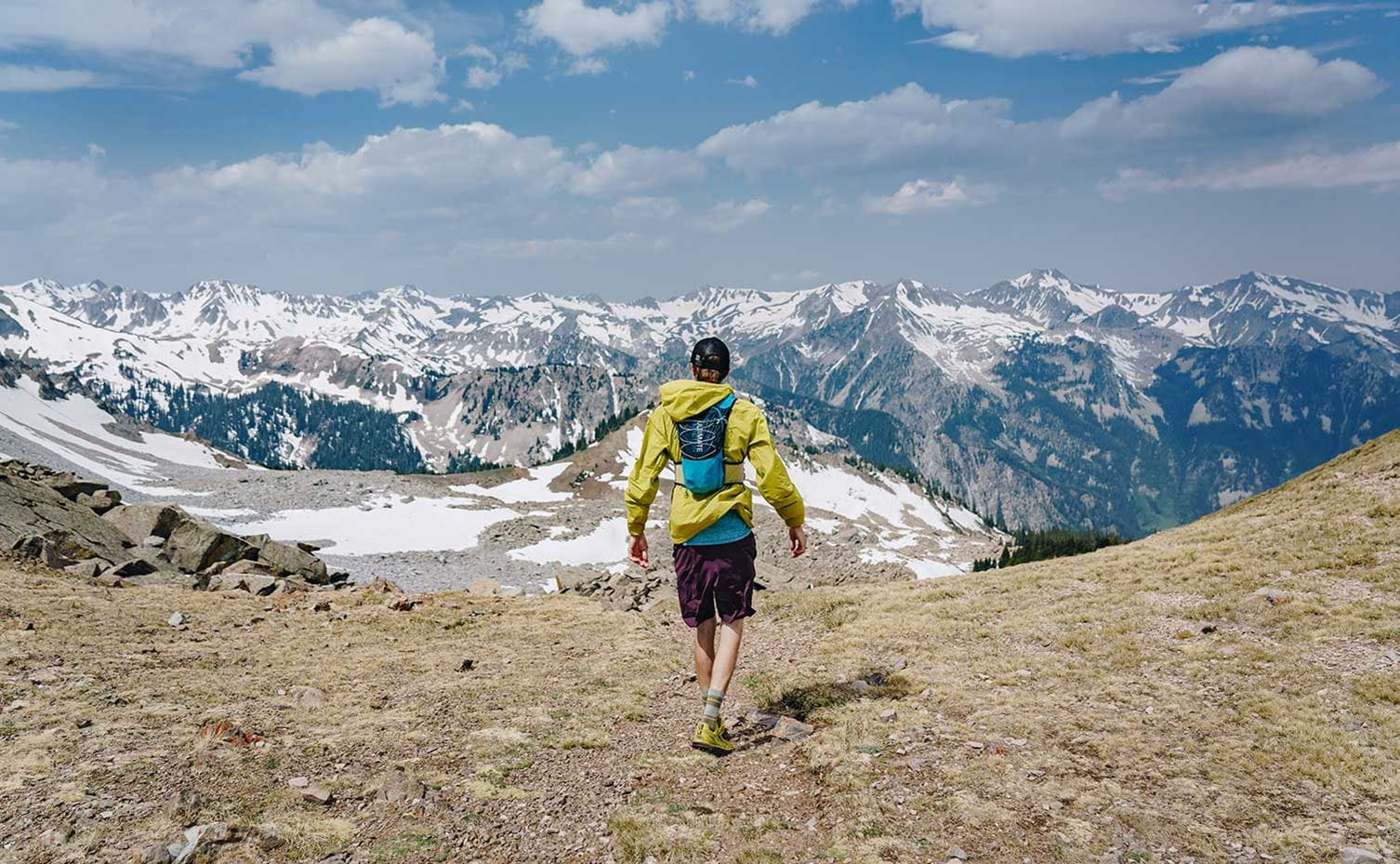 A hiker looking over the epic scenery near Aspen Snowmass