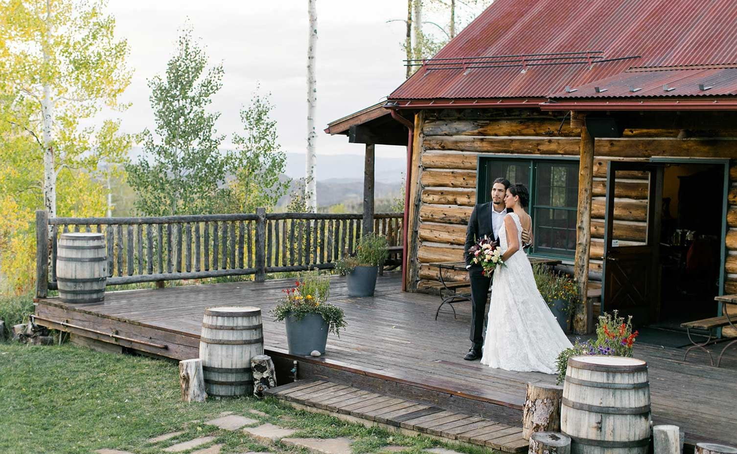 A couple enjoys their wedding at Lynn Britt Cabin Snowmass