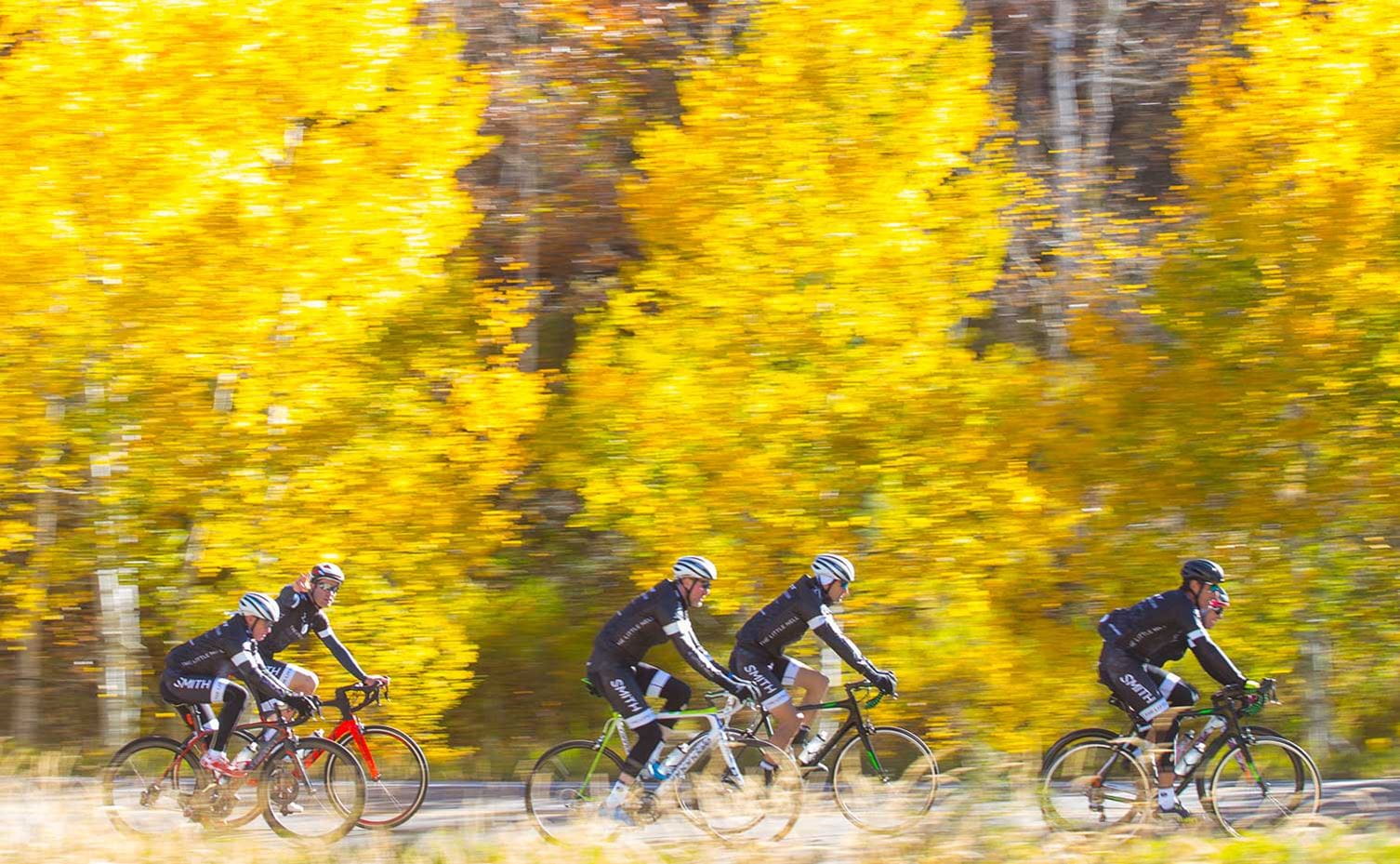 Cyclists riding up Maroon Creek Road near Aspen, CO in fall