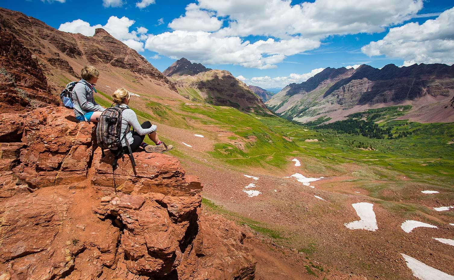 Hikers pause high above the Maroon Bells-Snowmass Wilderness