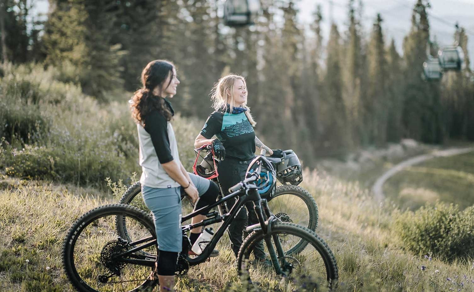 Two women take a break on the trails of the Snowmass Bike Park