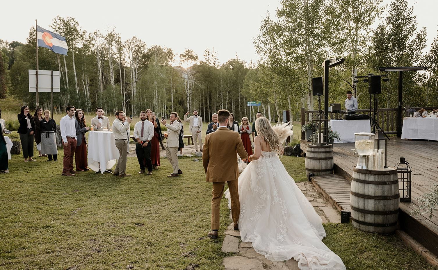 A couple is greeted at their wedding reception at Lynn Britt Cabin