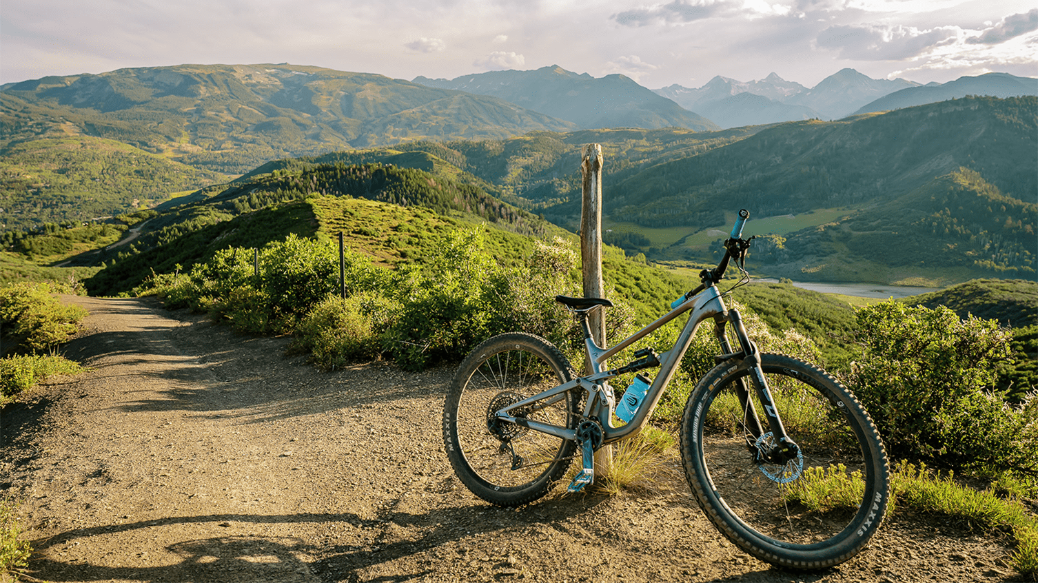 Mountain bike is propped against a pole overlooking the Aspen Snowmass Valley