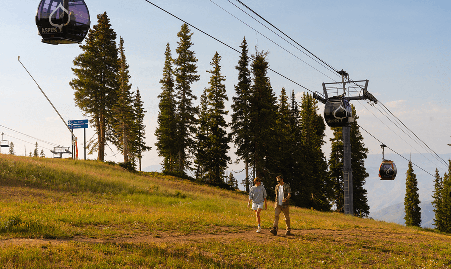 Couple hikes up Aspen Mountain under dusky glow of summer sun
