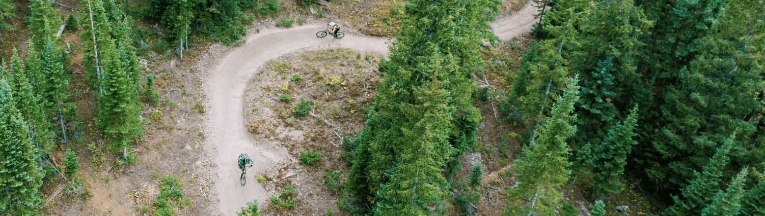downhill riders at snowmass