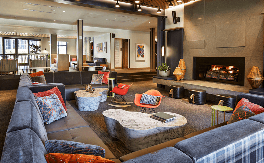 Sitting space in Limelight snowmass, comfortable couches with mountain chic touch