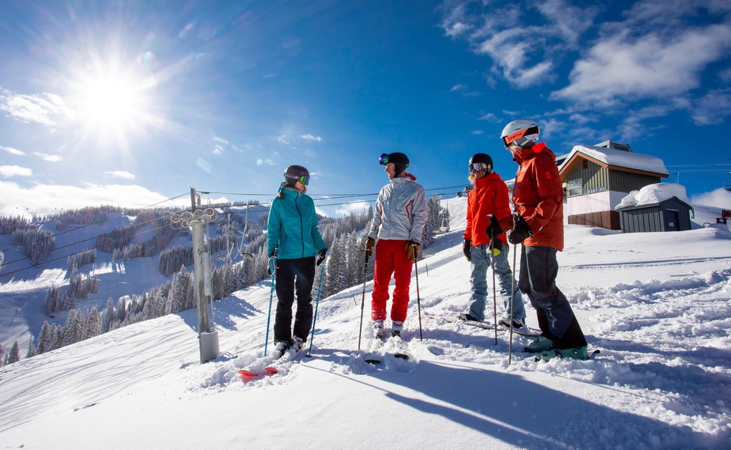 A ski instructor with guests at Aspen Snowmass