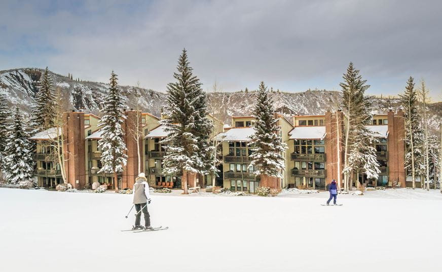 a group of people skiing in the snow