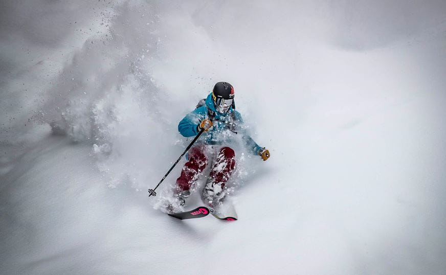 Skier in the powder on Aspen Mountain. 