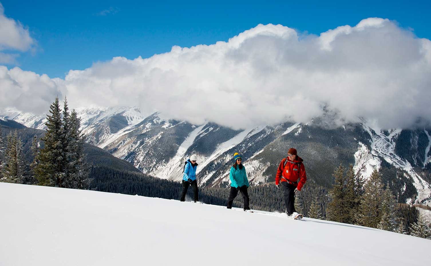Snowshoeing along a ridge above the clouds on Aspen Mountain