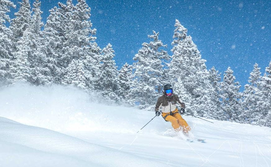 Skier enjoying ideal snow conditions on their new gear at Aspen Snowmass