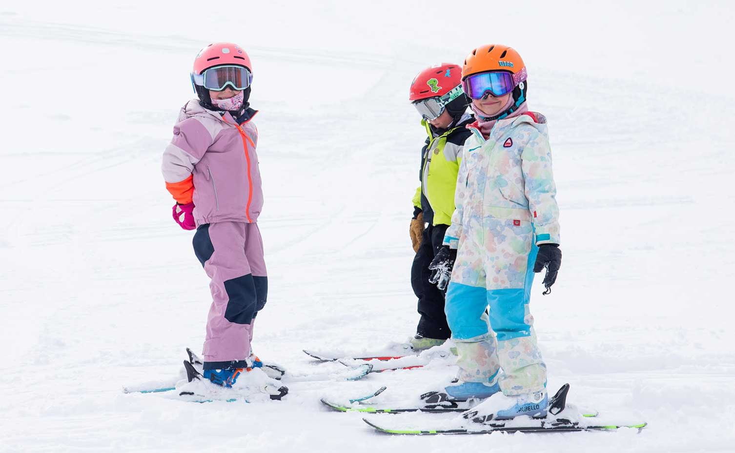 Three children learning to ski at Aspen Snowmass