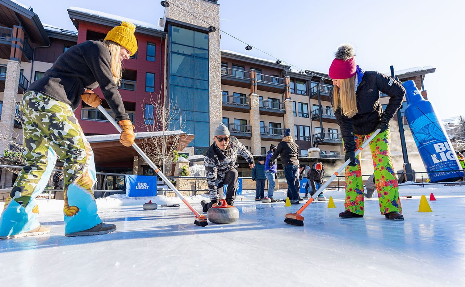 People curling in snowmass base village. 
