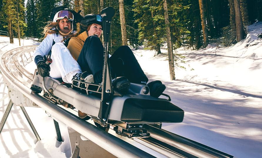 Two girls on the breathtaker alpine coaster in Snowmass in the winter