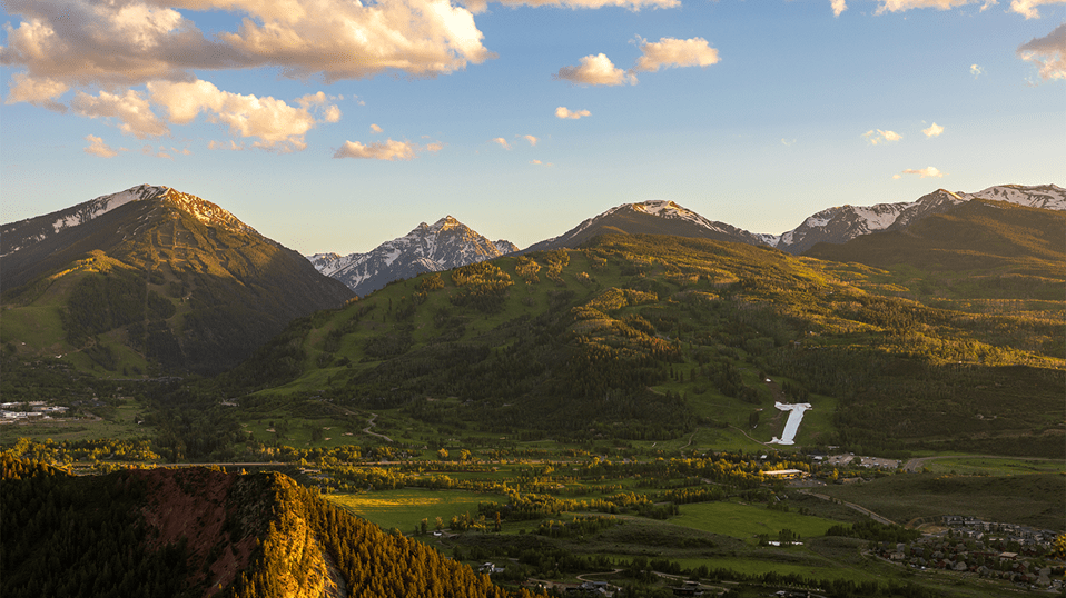 Buttermilk at sunset, green valley glows with golden light