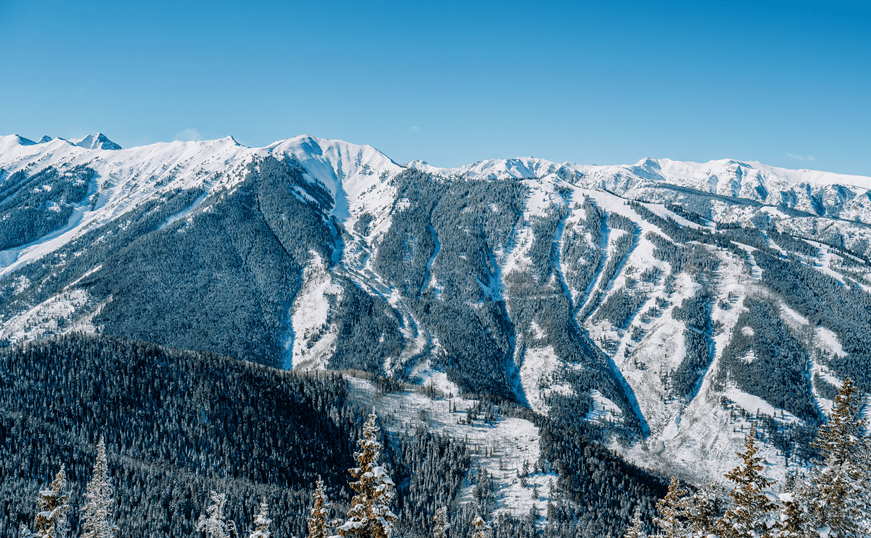 Scenic view of Aspen Highlands, little white ski runs and the highlands bowl, on a blue bird day