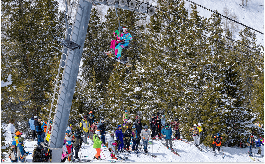 People on the mountain and chairlift in fun outfits during spring
