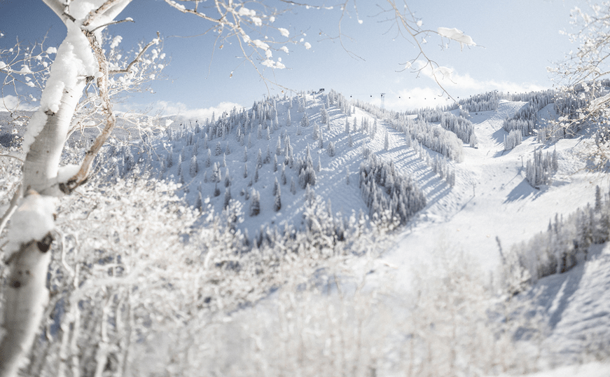 Snowy mountains glisten in the morning sun at Aspen Mountain