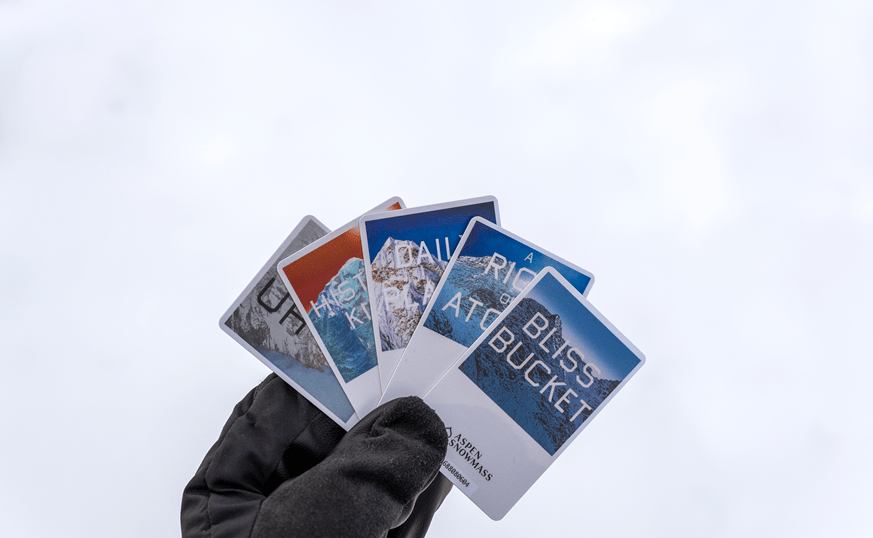 Five lift tickets for 2025-26, designed by Ed Ruscha for Aspen Snowmass