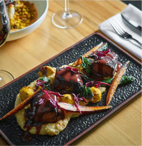 grits and vegetables atop a nice plate at the Cabin at Snowmass