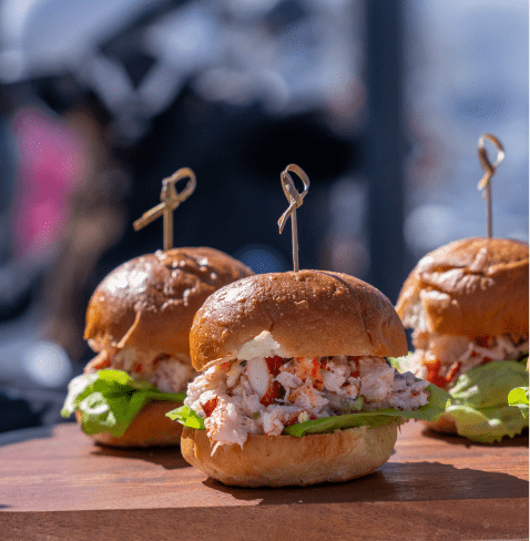 crab cakes on toasted buns wish fresh lettuce at Eleven212