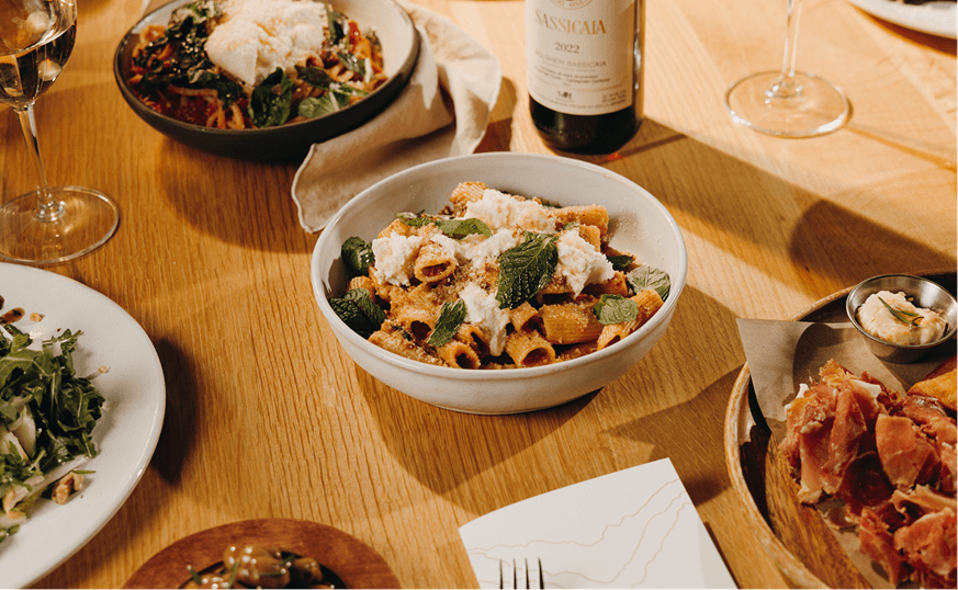 wood table covered in decadent homemade pasta at Sams fine dining on snowmass mountain