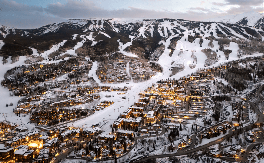 Dusk at Snowmass, little yellow lights dot the ski slopes as dusk falls on the ski hill