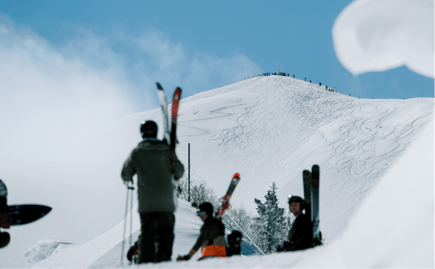 people hiking up to the top of frosty highlands bowl on a cold winter day