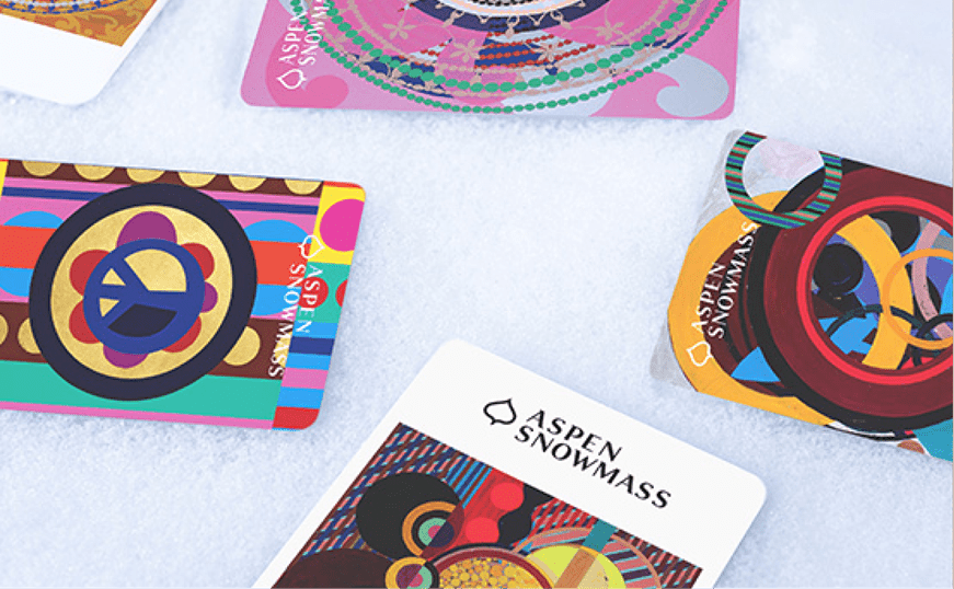 26-27 lift ticket art on aspen snowmass cards in the snow