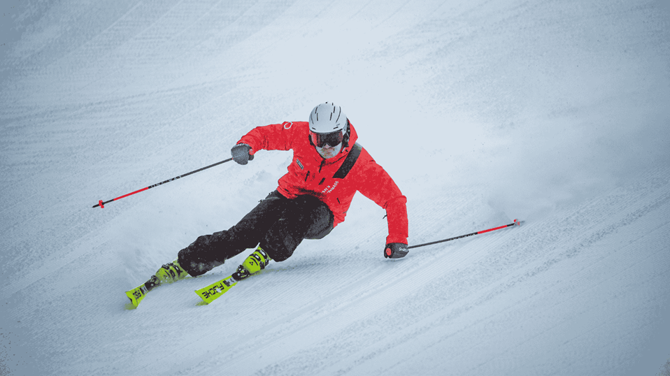 Male Ski Pro carving close-up shot